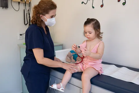 Pediatrician supporting child healthcare and family guidance